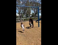 Dad pushes kids boy falls down swing