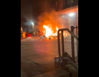 Garbage piled on street on huge fire