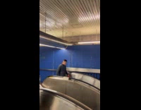 Cable hang swing from ceiling over escalator