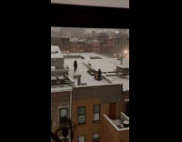 Man walk barefoot on building rooftop snow