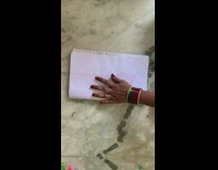 Filmer pull colored strings on folded white paper Part 2