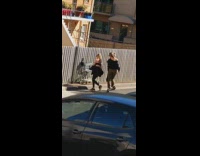 Three girls dance punch shopping cart alley