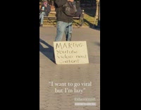 Guy at park with need content sign 