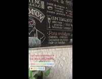 Red cape empanadas black tank top guy