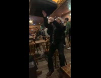 Guy spinning couch cushion on finger 