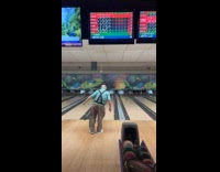 Old man plays bowling gets a strike
