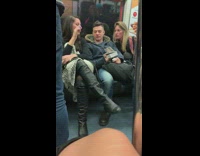 Guy gets bothered by women while reading book on subway train