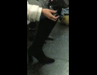 woman black boots heel broken