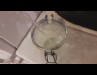 Man drinks a liter of water in a glass jar