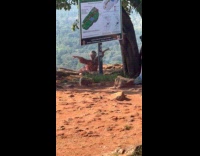 Woman spread arms pose rock fort top