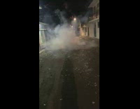 Firecrackers lit in then middle of the street