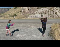 Black shirt lady poses with bone asphalt 