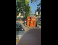 Guy and lady walk out of same porta potty 