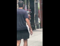 Shirtless person wearing pink pants, headdress and fox tail