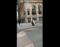 Guy wears cardboard box trash bag cape