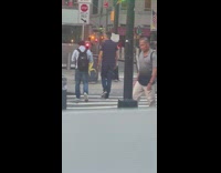 Man with Digital Monitor Helmet Walks Around