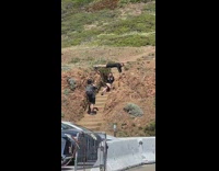 Woman sits on the stairs with a woman on top of her