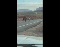 Man rides the skateboard in stationary at the highway
