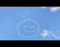 Skywriting drawing of happy face in sky