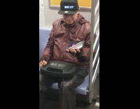 Guy wears LED hat on subway 