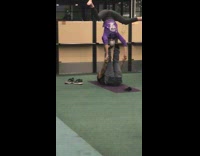 Couple does yoga middle of airport lobby 
