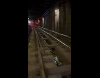 Man walk on subway tunnel train tracks