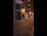 Guy walk empty street lights night pavement