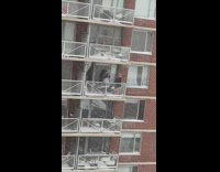 Woman black jacket balcony snow storm daddy