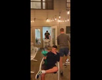 Guy asks for help getting white table out of door 