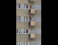 Blue shirt person black balcony selfie sunset 