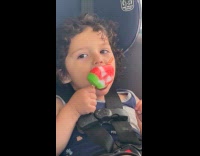 Kids enjoy ice cream during car ride