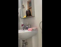 Yellow shirt girl blows white powder bathroom 