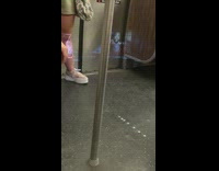 Guy uses projector on the subway