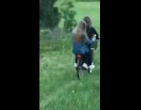 two girls on tandem bike fall downhill 