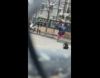 Guy in spiderman outfit hanging upside down