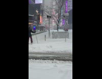 Red pants guy walks through snow skis 