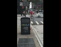 Guy riding unicycle crosses street