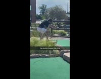 Guy warms up to hit golf ball 