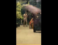 Woman orange dress lay down furniture restaurant Part 2