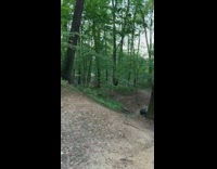 Guy rides yellow bicycle over ramp fail