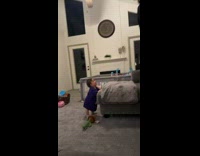 Dad hops over baby and makes it laugh 