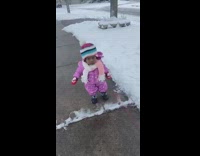 Young girl purple jacker walk street winter