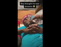 Friends prank asleep friend by pouring water