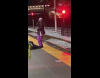 man purple pants yoga platform