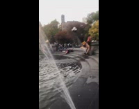 Man black bikini dance fountain park