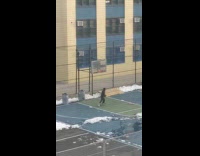 Guy ride and throw skateboard basketball court