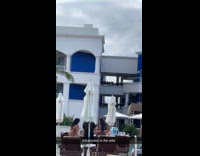 Two women beach wear tiktok at resort