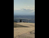 woman stands upside down cliff Japan