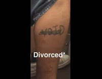 man with divorced and void tattooed on leg is asleep