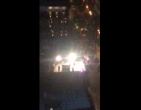 Three people dance perform rooftop with lights